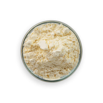 Curd in a glass bowl on a white background