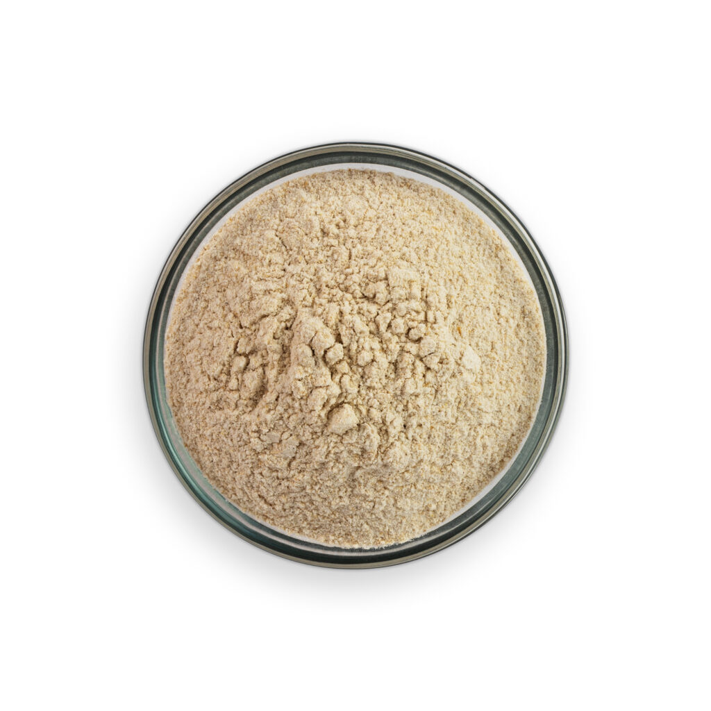 Beige powder in a glass container on a white background