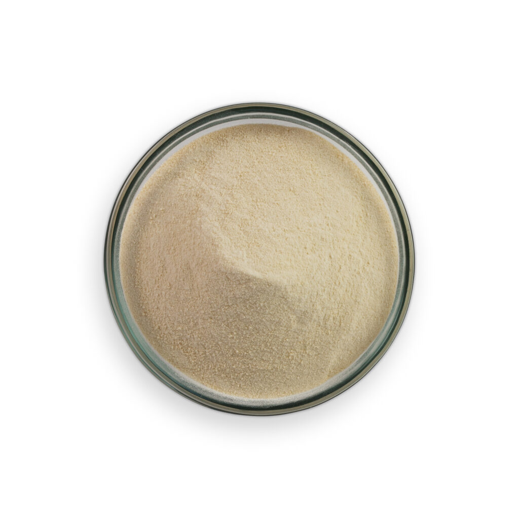 Beige powder in a glass container on a white background