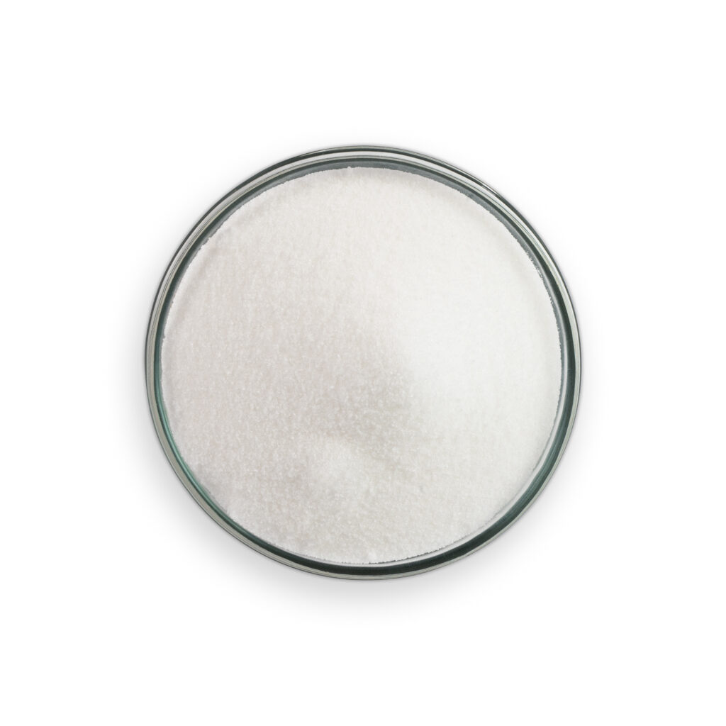 Clear glass container with white powder on a white background