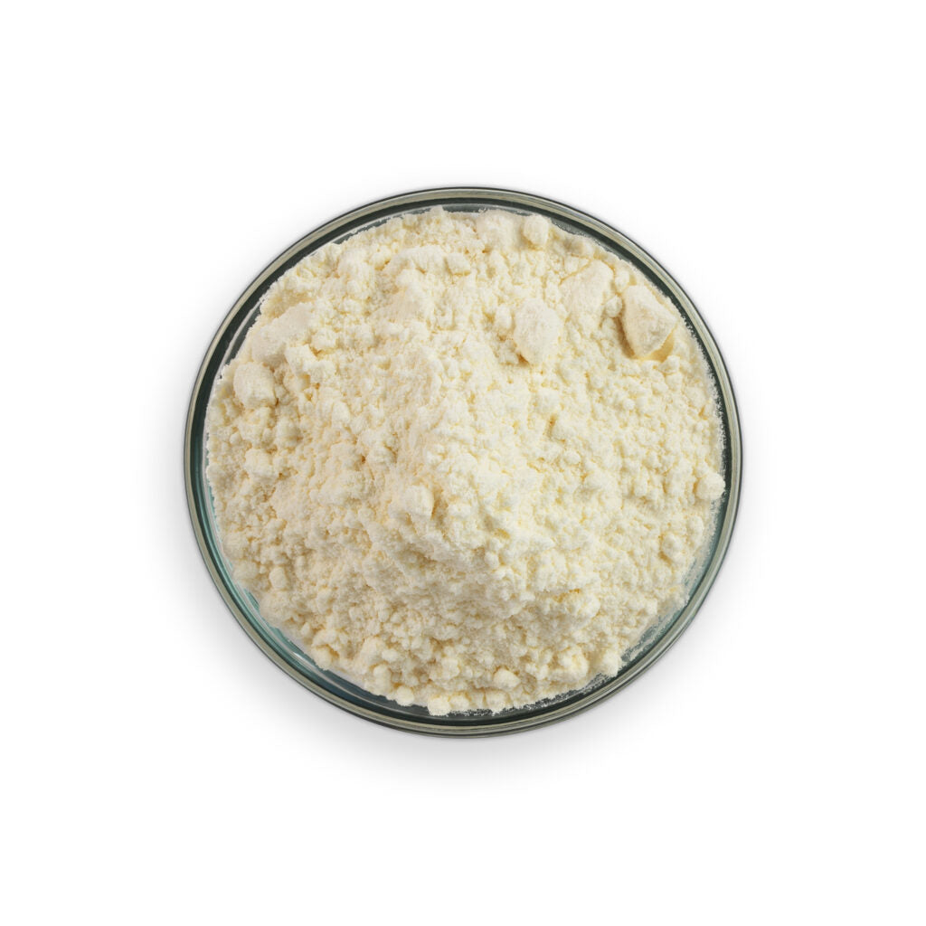 Glass bowl filled with a white powdery substance on a white background