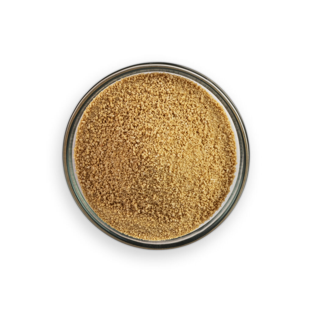 Glass container with brown granular substance on a white background