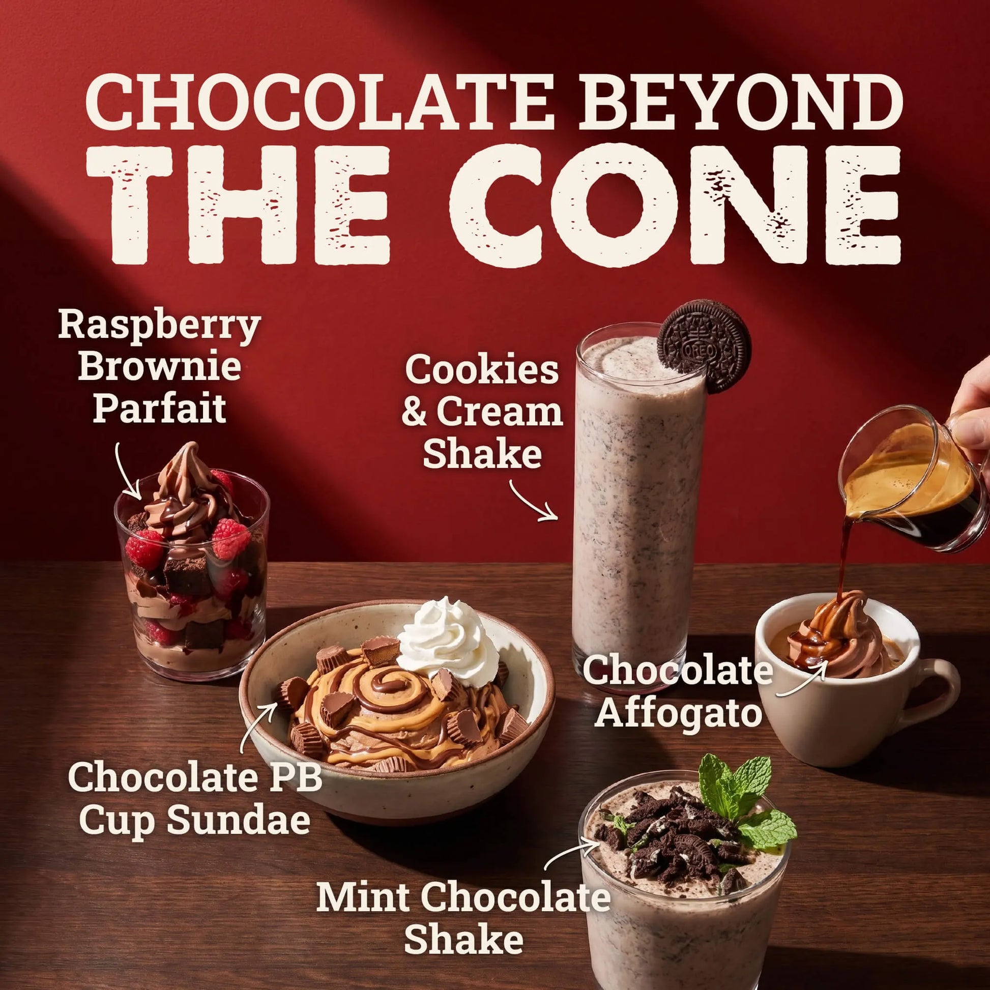 Promotional graphic for 'Chocolate Beyond the Cone' featuring six chocolate-themed desserts arranged on a wooden table against a dark red background. The desserts include a Raspberry Brownie Parfait, Cookies & Cream Shake, Chocolate PB Cup Sundae, Chocolate Affogato, and Mint Chocolate Shake, with handwritten labels pointing to each item.