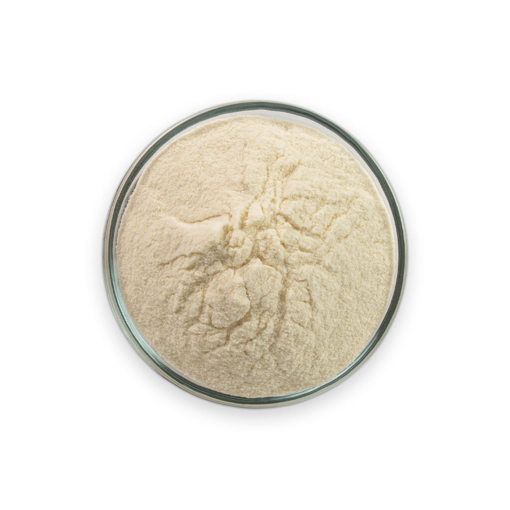 Beige powder in a glass container on a white background