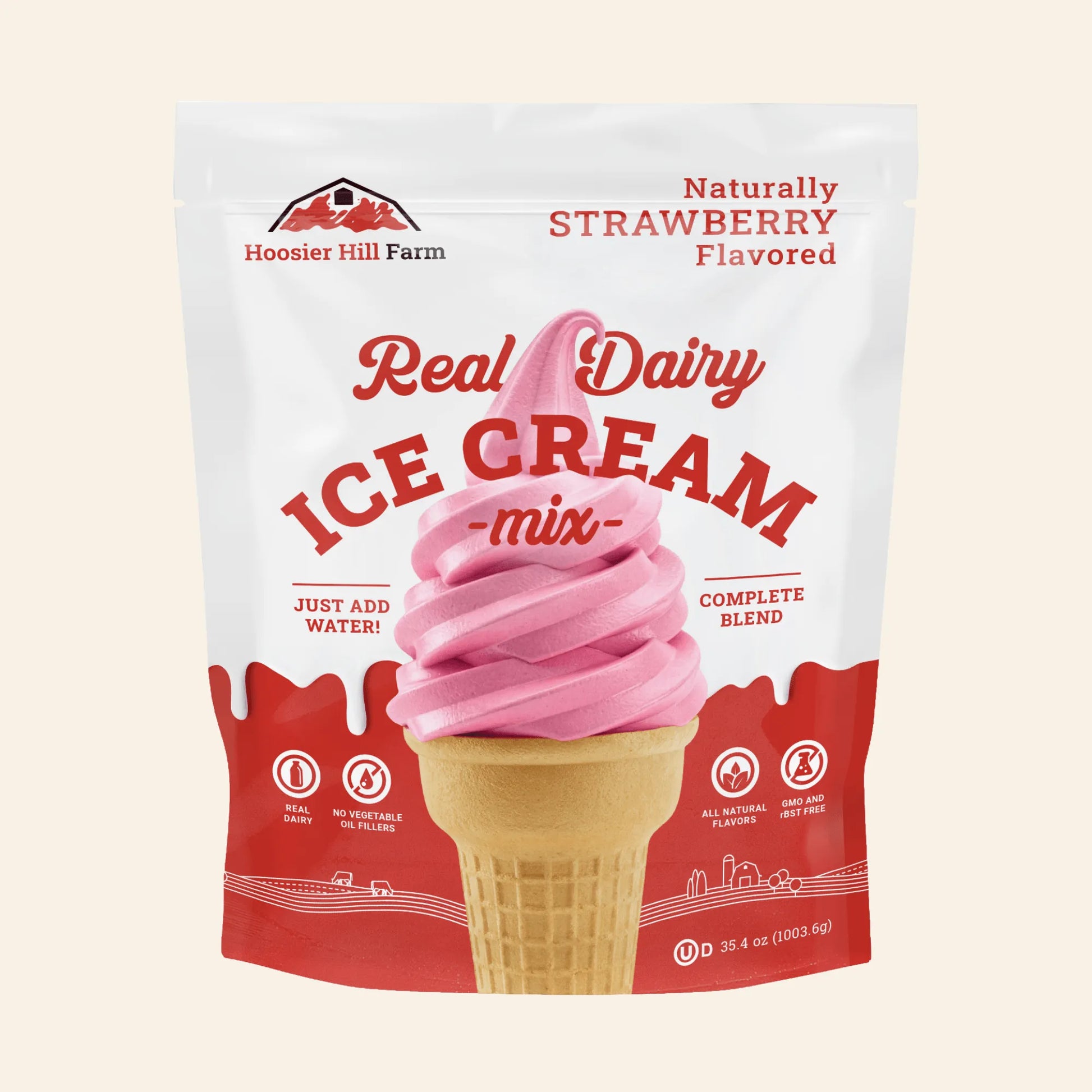 A stand-up pouch of Hoosier Hill Farm Real Dairy Ice Cream mix, strawberry flavored, with a pink swirl ice cream cone graphic on a white and red package against a light beige background.